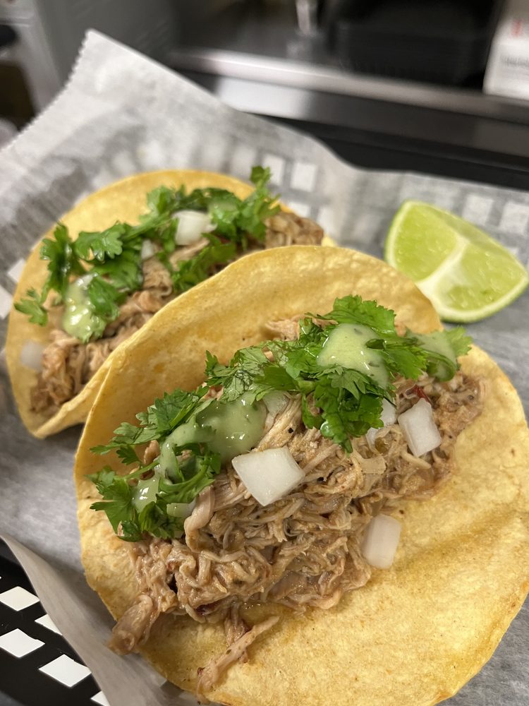 Carnitas tacos with avocado crema